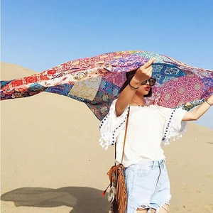 Bohemian colorful patchwork shawl scarf with fringe blowing in the desert breeze