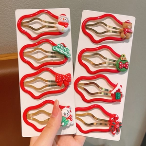 8-piece Christmas hair clip set for girls with snowman and gingerbread motifs