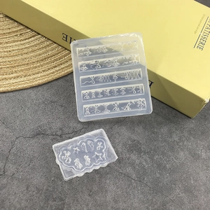 3D bow and butterfly wing silicone nail art molds set on a textured grey background
