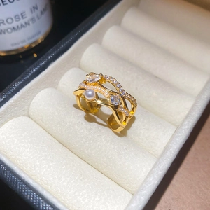 Detailed macro of 18k gold layered ring with pearls and pavé cubic zirconia