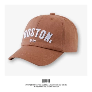 Detail of caramel cotton baseball cap featuring white Boston 1630 embroidery