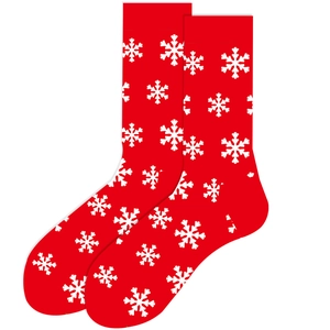 Detail of red Christmas socks with white snowflake patterns and soft cotton fabric