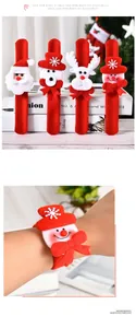Close-up of plush Christmas slap bracelets with Santa, bear and reindeer doll details