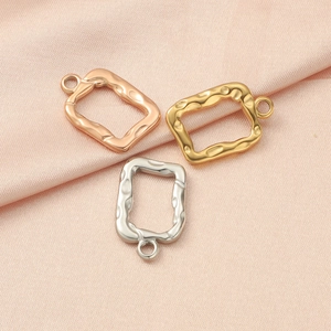 Detail of irregular hammer-textured rectangular photo frame pendants in gold, silver, rose gold