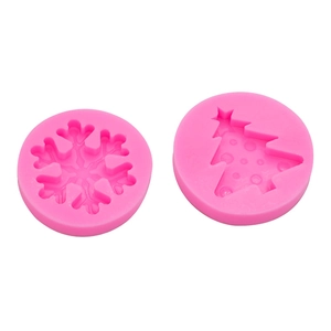 Pink silicone Christmas molds set featuring intricate snowflake and pine tree designs
