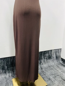 Detailed view of the brown ribbed knit texture on this elegant slim-fit maxi skirt