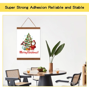 Detail of magnetic wooden poster hanger with rope on a modern minimalist wall