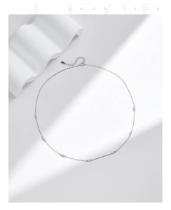 Detailed shot of S925 sterling silver choker featuring small round cubic zirconia accents