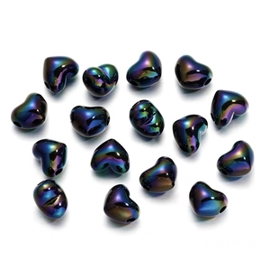 Macro shot of colorful heart-shaped iridescent beads on a clean white background