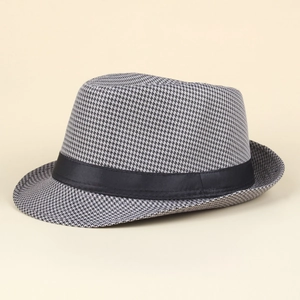 Close-up of grey houndstooth fedora hat featuring a smooth black ribbon band detail
