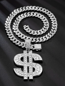 Close-up of a silver Cuban link necklace with a sparkling rhinestone dollar sign pendant