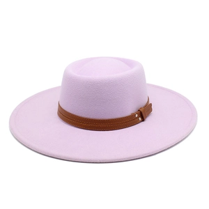 Close-up of lavender wool fedora hat with brown leather band and silver metal rivets