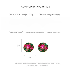 Detail view of round vintage earrings with pink and green rhinestones and 3cm dimensions