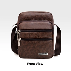 Front view of brown leather crossbody bag with multiple zippers and metal logo
