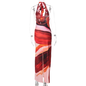 Detail of summer halter maxi dress with red abstract floral print and side slit design