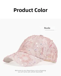 Detail of pink mesh baseball cap featuring lace flowers and iridescent sequins