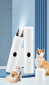 Detail of electric pet nail grinder with LED light showing diamond bit and safety cap