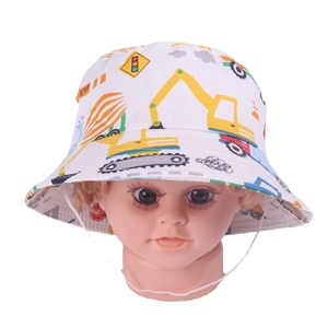 Detail showing white kids bucket hat with colorful construction vehicle prints and chin strap