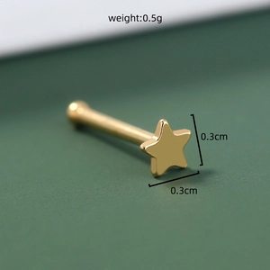 Close-up of golden star-shaped stud showing 0.3cm dimensions and 0.5g weight detail