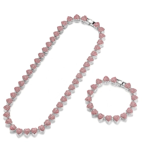Close-up of pink crystal heart links on silver necklace and bracelet jewelry set