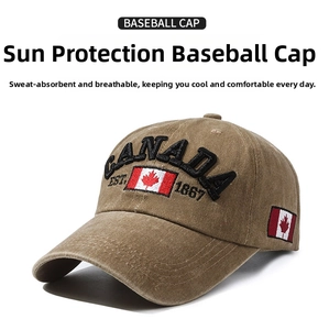 Close-up of Canada embroidery and maple leaf flag on khaki cotton baseball cap
