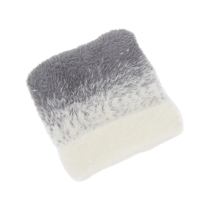 Macro detail of soft gradient plush fabric showing gray to white ombre faux fur texture
