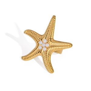 Detailed view of a gold starfish ring featuring five central white pearls on a white background