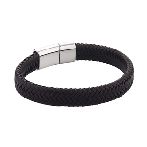 Macro detail of dark brown braided leather texture and polished silver magnetic clasp