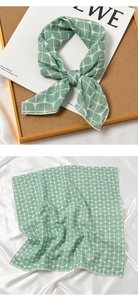 Detailed sage green and white geometric leaf pattern on cotton linen scarf fabric