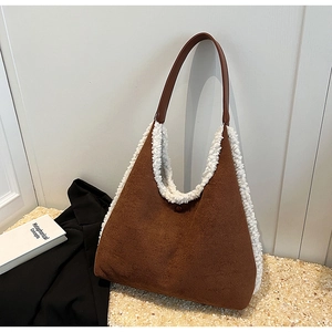 Brown suede shoulder tote bag with soft faux shearling trim in a minimalist aesthetic
