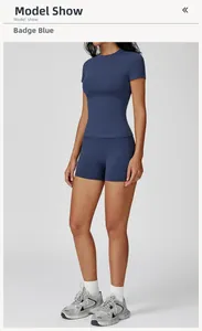 Detail of insignia blue slim-fit yoga set with high-waist shorts and short sleeve top