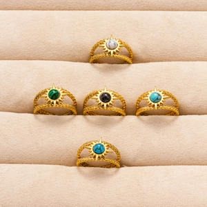 Set of gold 304 stainless steel sun rings with colorful stones in a jewelry tray
