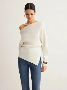 Elegant off-shoulder white knit sweater with asymmetrical hem and long sleeves