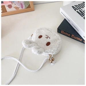 Detail of white plush rabbit crossbody bag featuring soft lamb wool texture and ears