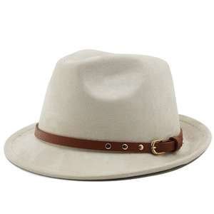 Close-up of light gray fedora hat featuring a brown leather strap with gold studs