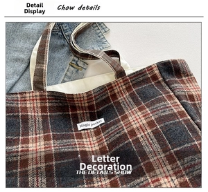 Close-up of vintage plaid tote bag featuring classic patterns and Magic Pocket label detail