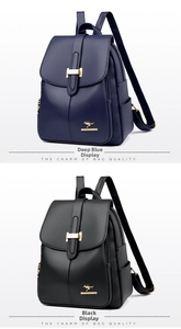 Detail view of navy blue and black litchi grain leather backpacks with golden kangaroo logo