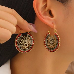 Bohemian gold-plated hollow geometric Sri Yantra earrings with red woven accents