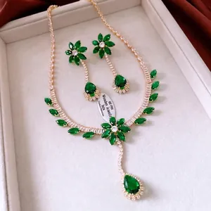 Vintage gold jewelry set with emerald green zircon flower pendants and fringe tassels