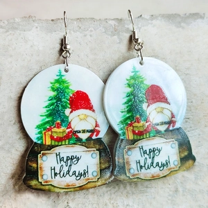 Detail of snowflake globe acrylic earrings with Happy Holidays text and festive motifs