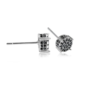 Detailed view of silver stud earrings featuring black round micro-pave cubic zirconia