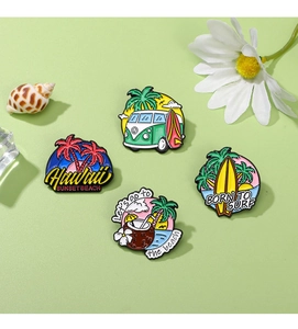 Close-up of summer enamel pins featuring retro bus, surfboard, and coconut beach designs