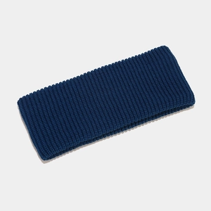 Close-up of navy blue ribbed knit headband showing soft textured fabric and elastic weave