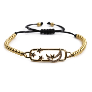 Adjustable gold star and moon bracelet with black woven cord and zircon accents