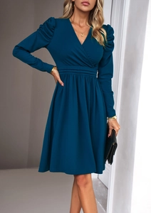 Detail of dark blue V-neck long sleeve dress with puff sleeves and pleated waist