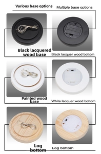 Detailed view of wooden LED bases in black, white, and natural wood for glass cloches