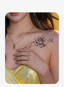 Detailed realistic rose and butterfly tattoo sticker on shoulder of a female model