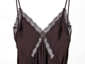 Detail of coffee brown satin top with delicate eyelash lace V-neck and silk texture