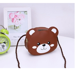 Detail of cute brown bear cartoon mini PU leather crossbody bag with woven strap