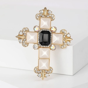 Baroque cross brooch with black and white crystals on a gold base for suits and coats